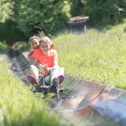 A mother and daughter go full throttle on Europe's longest summer toboggan run.  | © Hinterramskogler